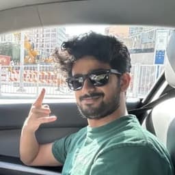 Anudeep in the back of a Waymo in downtown Austin